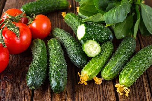 kaw-valley-harvesting-edibles-veggies-cucumbers-tomatoes.jpg